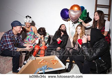 Group of people sitting at party View Large Photo Image Stock Photograph - Group of people sitting at party. Fotosearch