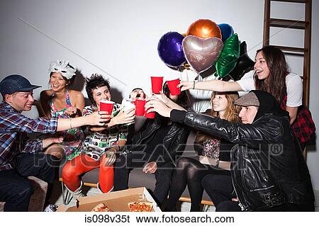 Group of people sitting at party View Large Photo Image Stock Photograph - Group of people sitting at party. Fotosearch