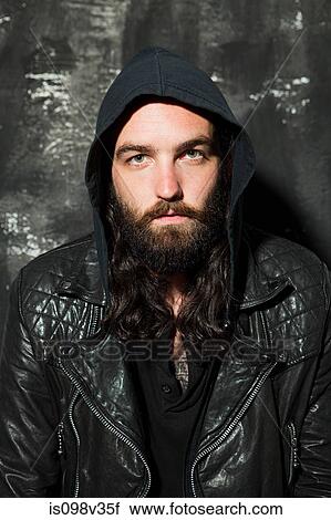 Stock Image - Man wearing leather jacket at party. Fotosearch