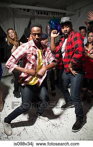 Men wearing checked shirts dancing at party View Large Photo Image Stock Image - Men wearing checked shirts dancing at party. Fotosearch