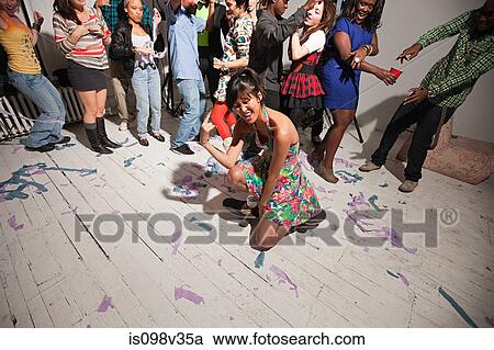 Stock Image - People dancing at party. Fotosearch