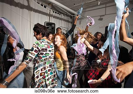 Stock Image - People dancing at party. Fotosearch