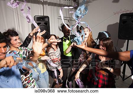 People dancing at party with streamers View Large Photo Image Stock Photo - People dancing at party with streamers. Fotosearch