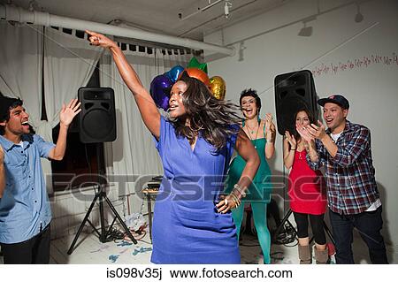 Woman wearing blue dress dancing at party View Large Photo Image Stock Image - Woman wearing blue dress dancing at party. Fotosearch