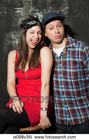 Young couple at party View Large Photo Image Stock Image - Young couple at party. Fotosearch