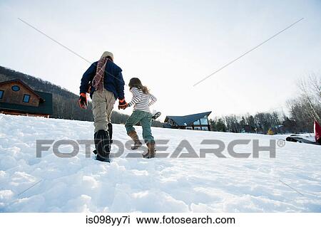 Brother and sister walking in snow View Large Photo Image Stock Image - Brother and sister walking in snow. Fotosearch