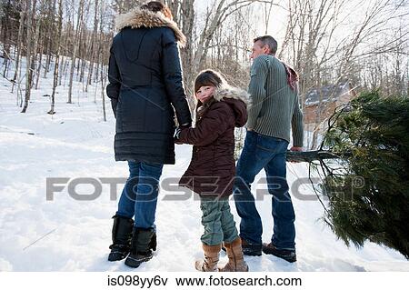 Family walking in snow View Large Photo Image Stock Photo - Family walking in snow. Fotosearch
