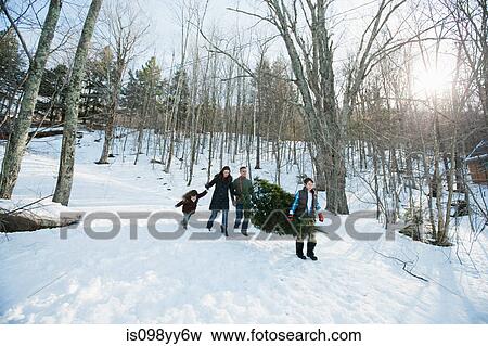 Family walking in snow View Large Photo Image Stock Photo - Family walking in snow. Fotosearch