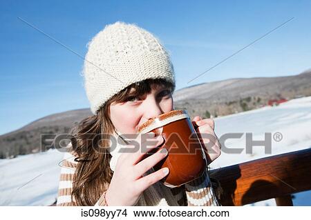 Picture - Girl drinking hot drink, portrait. Fotosearch