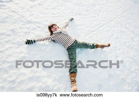 Girl making snow angel View Large Photo Image Stock Image - Girl making snow angel. Fotosearch