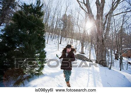 Girl running in snow View Large Photo Image Stock Image - Girl running in snow. Fotosearch