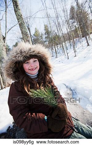 Stock Image - Girl wearing winter coat, portrait. Fotosearch