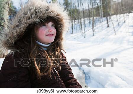 Stock Image - Girl wearing winter coat, portrait. Fotosearch