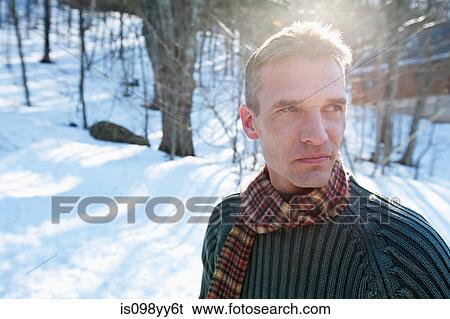 Stock Photograph - Man in snow, portrait. Fotosearch
