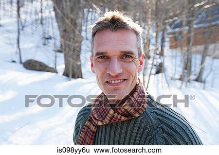 Stock Photograph - Man in snow, portrait. Fotosearch
