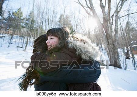 Picture - Mother and daughter embracing. Fotosearch