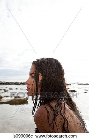 Stock Image - Woman on beach. Fotosearch