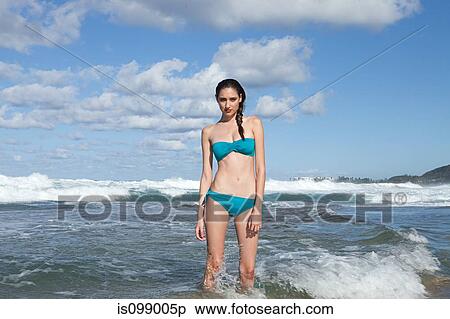 Woman wearing bikini standing in sea View Large Photo Image Stock Photography - Woman wearing bikini standing in sea. Fotosearch