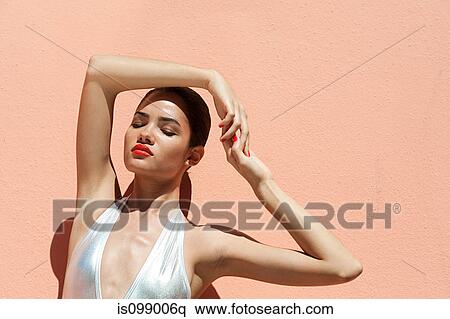 Stock Photography - Woman wearing sexy silver bikini. Fotosearch