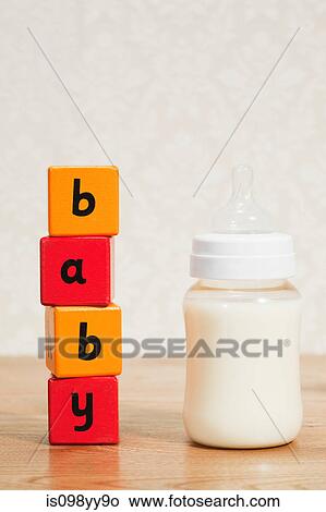 Baby formula and alphabet blocks View Large Photo Image Picture - Baby formula and alphabet blocks. Fotosearch