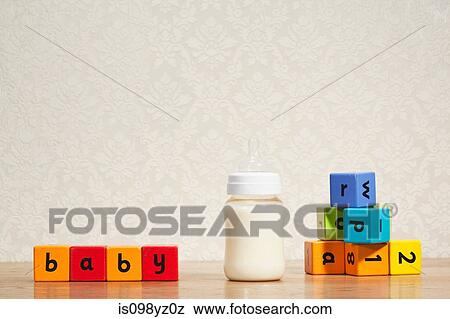 Baby milk and alphabet blocks View Large Photo Image Stock Photo - Baby milk and alphabet blocks. Fotosearch