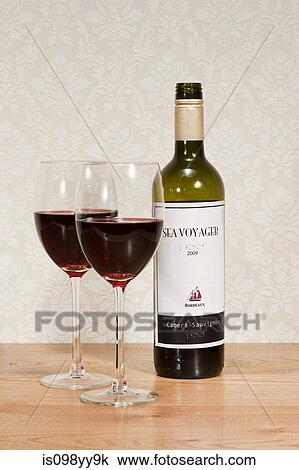 Bottle of red wine and wine glasses View Large Photo Image Stock Image - Bottle of red wine and wine glasses. Fotosearch