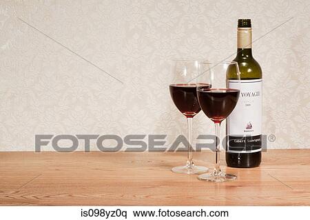 Bottle of red wine and wine glasses View Large Photo Image Stock Photography - Bottle of red wine and wine glasses. Fotosearch
