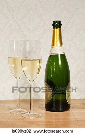 Champagne bottle and two glasses View Large Photo Image Stock Image - Champagne bottle and two glasses. Fotosearch