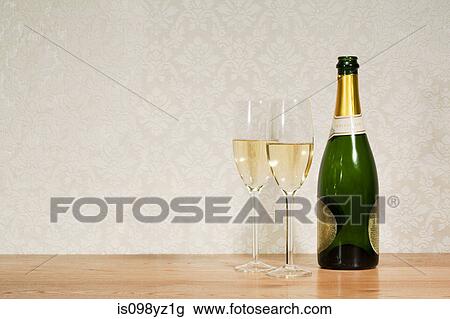 Champagne bottle and two glasses View Large Photo Image Stock Image - Champagne bottle and two glasses. Fotosearch