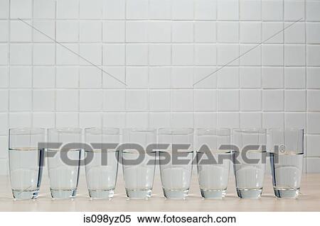 Eight glasses of mineral water View Large Photo Image Stock Photography - Eight glasses of mineral water. Fotosearch