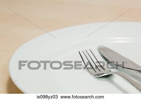 Empty plate with knife and fork View Large Photo Image Stock Image - Empty plate with knife and fork. Fotosearch