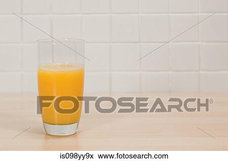 Glass of orange juice View Large Photo Image Stock Photo - Glass of orange juice. Fotosearch