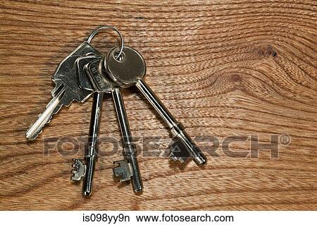 Keys against wooden background View Large Photo Image Picture - Keys against wooden background. Fotosearch