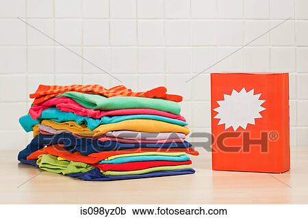 Piles of clean laundry and washing powder View Large Photo Image Stock Image - Piles of clean laundry and washing powder. Fotosearch