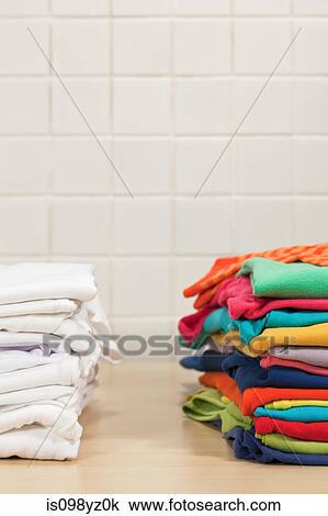 Piles of clean laundry View Large Photo Image Stock Image - Piles of clean laundry. Fotosearch