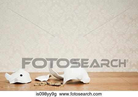Smashed piggy bank and coins View Large Photo Image Stock Image - Smashed piggy bank and coins. Fotosearch