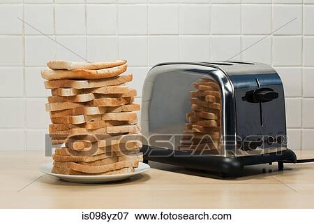 Stack of toast and toaster View Large Photo Image Stock Photo - Stack of toast and toaster. Fotosearch