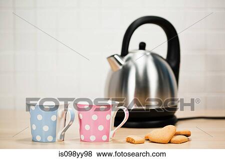 Tea and biscuits with kettle View Large Photo Image Stock Photo - Tea and biscuits with kettle. Fotosearch