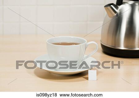 Teacup and kettle View Large Photo Image Stock Photo - Teacup and kettle. Fotosearch
