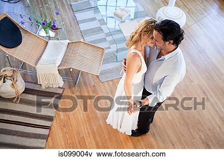 Couple dancing at home, high angle view View Large Photo Image Stock Photo - Couple dancing at home, high angle view. Fotosearch