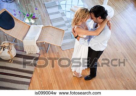 Couple dancing at home, high angle view View Large Photo Image Stock Photo - Couple dancing at home, high angle view. Fotosearch