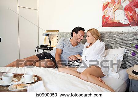 Stock Image - Couple in bed. Fotosearch