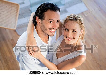 Couple looking up, high angle view View Large Photo Image Stock Photo - Couple looking up, high angle view. Fotosearch