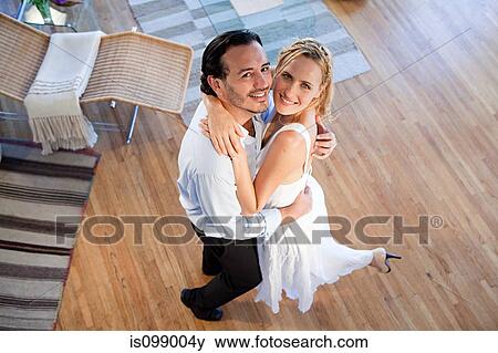 Couple looking up, high angle view View Large Photo Image Stock Photo - Couple looking up, high angle view. Fotosearch