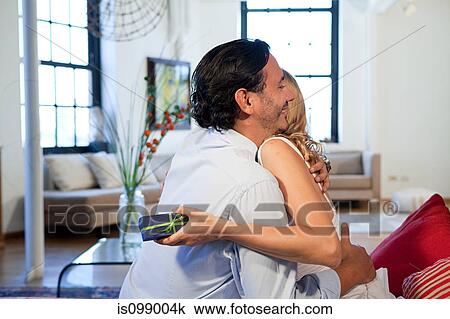 Loving couple with gift View Large Photo Image Stock Image - Loving couple with gift. Fotosearch