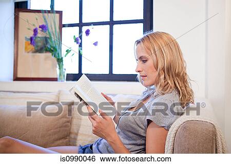 Woman reading a book View Large Photo Image Stock Photograph - Woman reading a book. Fotosearch