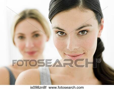 Portrait of two young women in bathroom View Large Photo Image Stock Image - Portrait of two young women in bathroom. Fotosearch