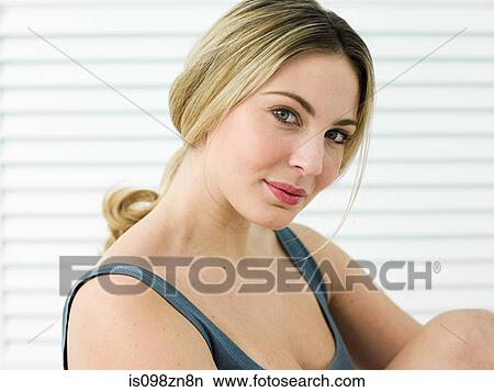Portrait of young woman in bathroom View Large Photo Image Picture - Portrait of young woman in bathroom. Fotosearch