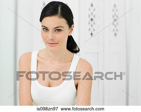 Stock Photo - Portrait of young woman in bathroom. Fotosearch