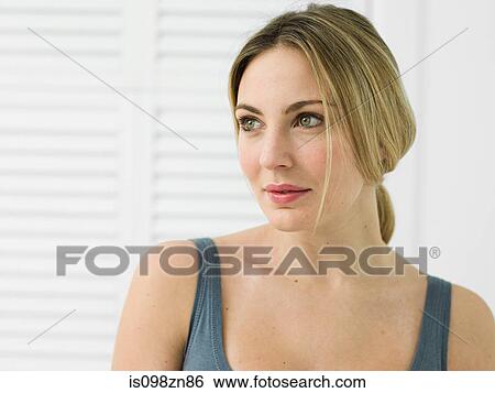 Portrait of young woman in bathroom View Large Photo Image Stock Photograph - Portrait of young woman in bathroom. Fotosearch